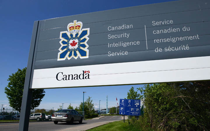 A sign for the Canadian Security Intelligence Service building is shown in Ottawa on May 14, 2013. Canada's spy agency is openly warning that Russia and China are out to steal the country's most prized secrets.