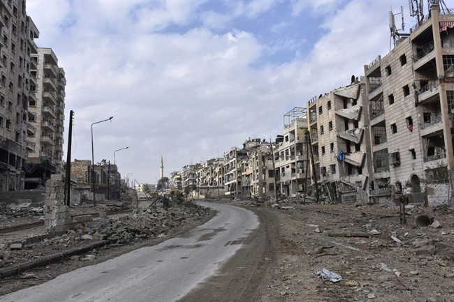 This photo released by the Syrian official news agency SANA, shows damaged buildings in the Ansari neighborhood, east Aleppo, Syria, Friday, Dec 23, 2016.