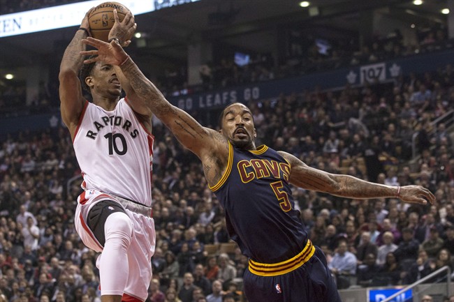 Cleveland Cavaliers guard J.R. Smith (right) tries to stop Toronto Raptors guard DeMar DeRozan drives to the basket during first half NBA basketball action in Toronto on Monday December 5, 2016. THE CANADIAN PRESS/Chris Young.