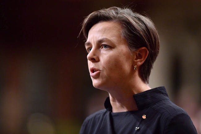 The OPP is investigating after a banner was hung on Conservative leadership candidate Kellie Leitch's constituency office in Collingwood, Ont.