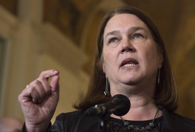 Minister of Health Jane Philpott speaks with the media during a break in meetings at the Finance Ministers meeting in Ottawa, Monday, December 19, 2016. Philpott has been cleared of any ethics breach over her use of a driving service owned by one of her campaign volunteers. THE CANADIAN PRESS/Adrian Wyld.