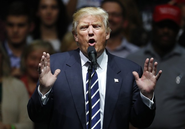 In this Dec. 9, 2016, photo, President-elect Donald Trump speaks to supporters during a rally, in Grand Rapids, Mich. In claiming that he scored ‚Äúa massive landslide victory‚Äù in last month‚Äôs presidential election, Trump turned history upside down. In fact, his winning margin in the Electoral College is on the other end of the historical spectrum, far closer to the narrowest win in history than to the widest. 