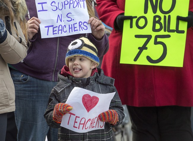 Students and parents protest outside the legislature in Halifax on Monday, Dec. 5, 2016. 