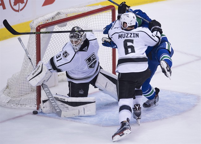 Los Angeles Kings defenceman Jake Muzzin (6) tries to clear Vancouver Canucks right wing Jack Skille (9) from in front of Los Angeles Kings goalie Peter Budaj (31) during third period NHL action in Vancouver, B.C., Wednesday, December 28, 2016. 