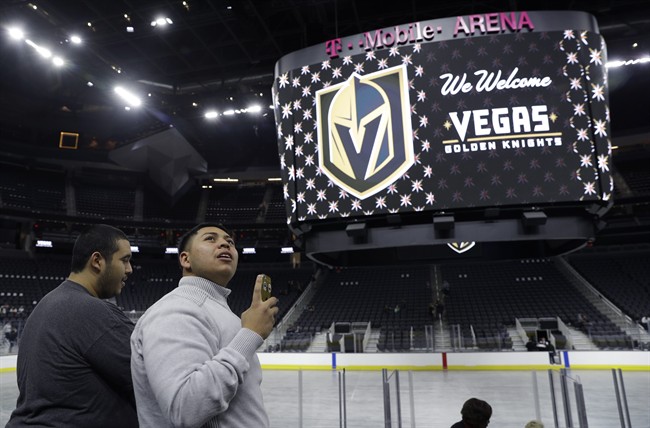 FILE – In this Nov. 22, 2016, file photo, people tour T-Mobile Arena during an event to unveil the name of Las Vegas’ National Hockey League franchise, in Las Vegas.