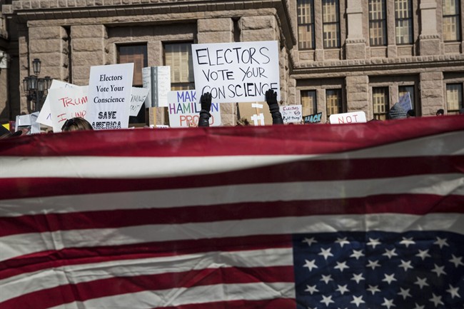 Demonstrators gather outside the Texas State Capitol in an attempt to influence the 38 Republican electors from across the state to not vote for Donald Trump when they cast their formal ballots for president of the United States in Austin, Texas, Monday, Dec. 19, 2016.
