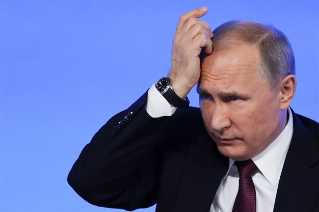 Russian President Vladimir Putin gestures during his annual news conference in Moscow, Russia, Friday, Dec. 23, 2016.