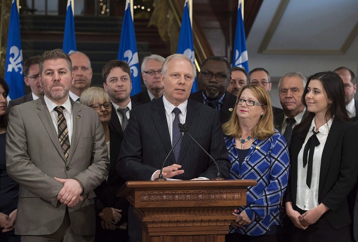 (L-R) PQ members Pascal Berube, Stephane Bergeron, Lorraine Richard, Martin Ouellet, Gaetan Lelievre, Jean-Francois Lisee, Maka Kotto, Carole Poirier, Francois Gendron and the newly elected candidate Catherine Fournier.