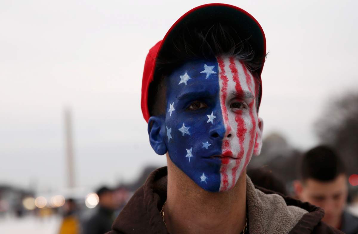 Supporters of U.S. President-elect Donald Trump gathers in the foreground of the Washington Monument on the National Mall prior to Trump’s inauguration as the nation’s 45th president in Washington, U.S., January 20, 2017. REUTERS/Shannon Stapleton