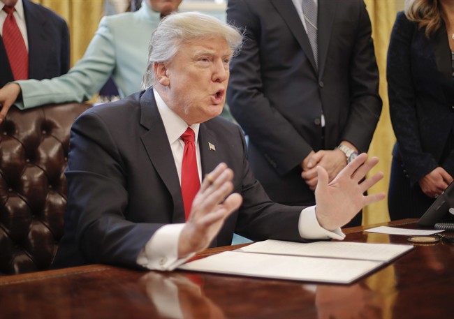 President Donald Trump speaks in the Oval Office of the White House in Washington, Monday, Jan. 30, 2017, before signing an executive order. 