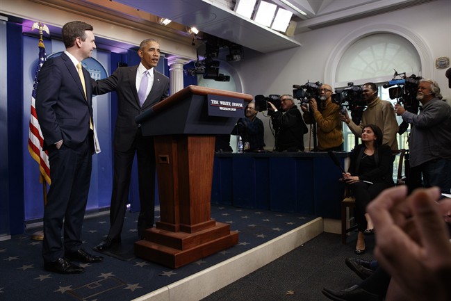President Barack Obama stands with White House press secretary Josh Earnest during his last press briefing, Tuesday, Jan. 17, 2017, in the briefing room of the White House in Washington. (AP Photo/Evan Vucci).