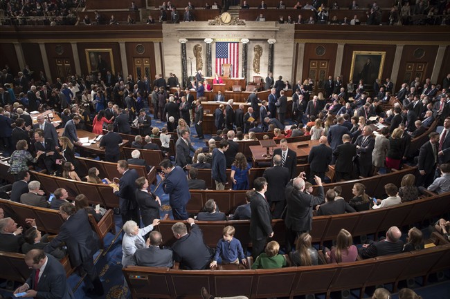 Members of the House of Representatives, some joined by family, gather in the House chamber on Capitol Hill in Washington, Tuesday, Jan. 3, 2017, as the 115th Congress gets under way.