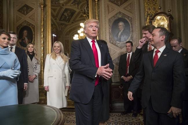 President Donald Trump leaves the President’s Room of the Senate on Capitol Hill in Washington, Friday, Jan. 20, 2017, after he formally signed his cabinet nominations into law.