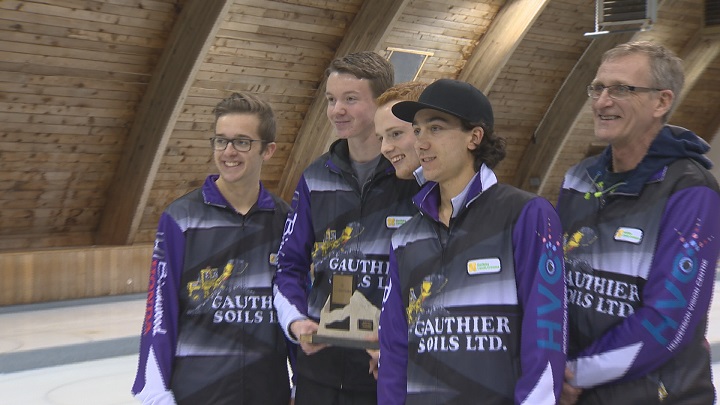 Skip JT Ryan, Third Jacques Gauthier, Second Graham McFarlane, Lead Brendan Bilawka, and Coach John Lund pose with the trophy after winning the Junior Men's Provincial Championships.