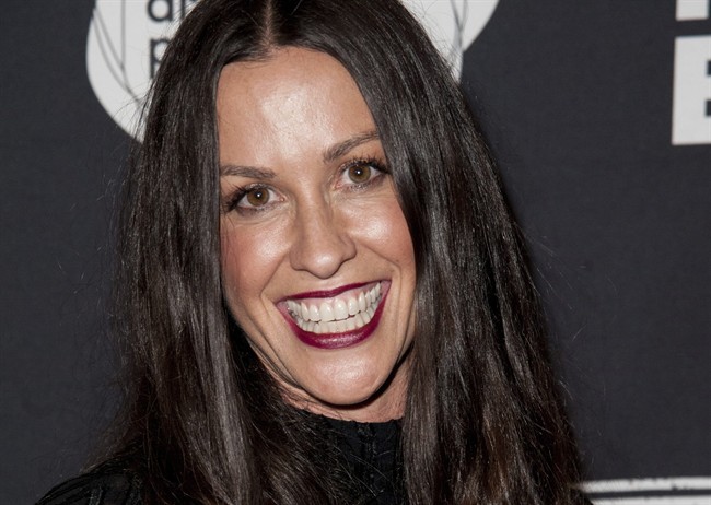 This June 20, 2014 file photo Alanis Morissette arrives at the 4th Annual Production Of The 24 Hour Plays After-Party in Santa Monica, Calif. 