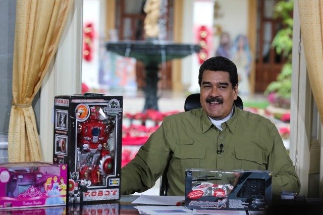 Venezuela’s President Nicolas Maduro speaks next to children toys during his weekly broadcast “En contacto con Maduro” (In contact with Maduro) at Miraflores Palace in Caracas, Venezuela on December 18, 2016.