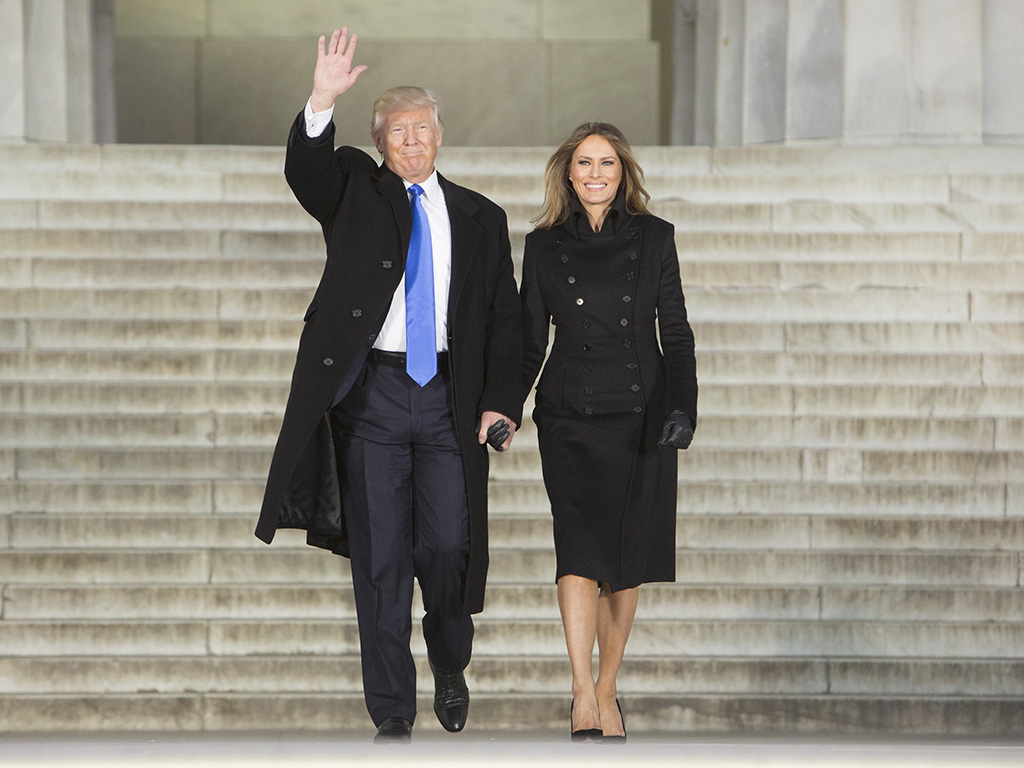 Melania Trump wears a military-inspired coat by New York designer Norisol Ferrari.