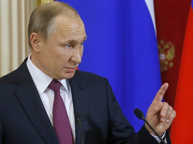 Russian President Vladimir Putin speaks at a joint news conference.(Sergei Ilnitsky/Pool Photo via AP).