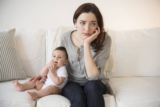 Mother with new baby suffering from postpartum depression.