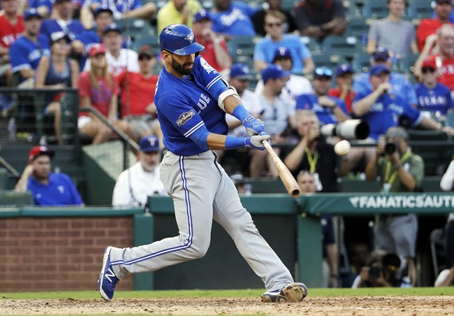 In this Thursday, Oct. 6, 2016, file photo, Toronto Blue Jays' Jose Bautista connects for a three-run home run off Texas Rangers' Jake Diekman during the ninth inning in Game 1 of baseball's American League Division Series, in Arlington, Texas.