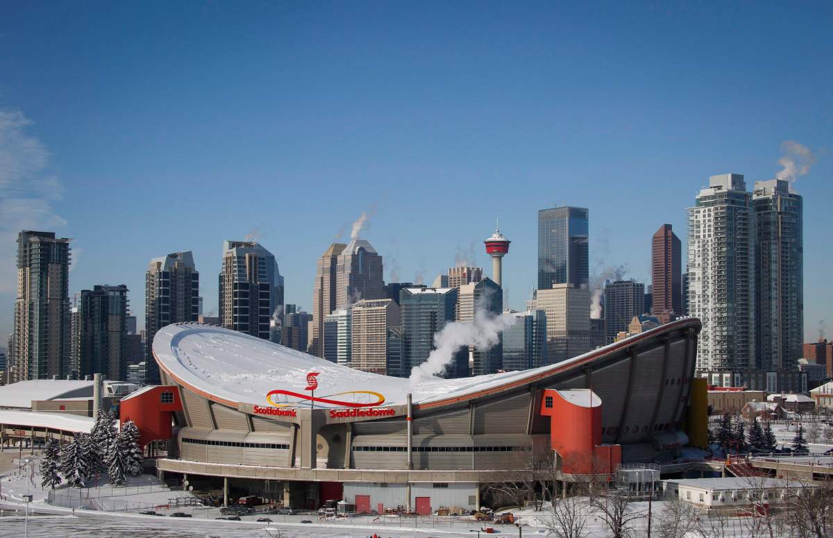 Steam rises from buildings near the Scotiabank Saddledome in Calgary, Alta., Wednesday, Feb. 8, 2017. New census data shows the population of the metropolitan area of Calgary outpaced the national growth rate over the last five years. THE CANADIAN PRESS/Jeff McIntosh.