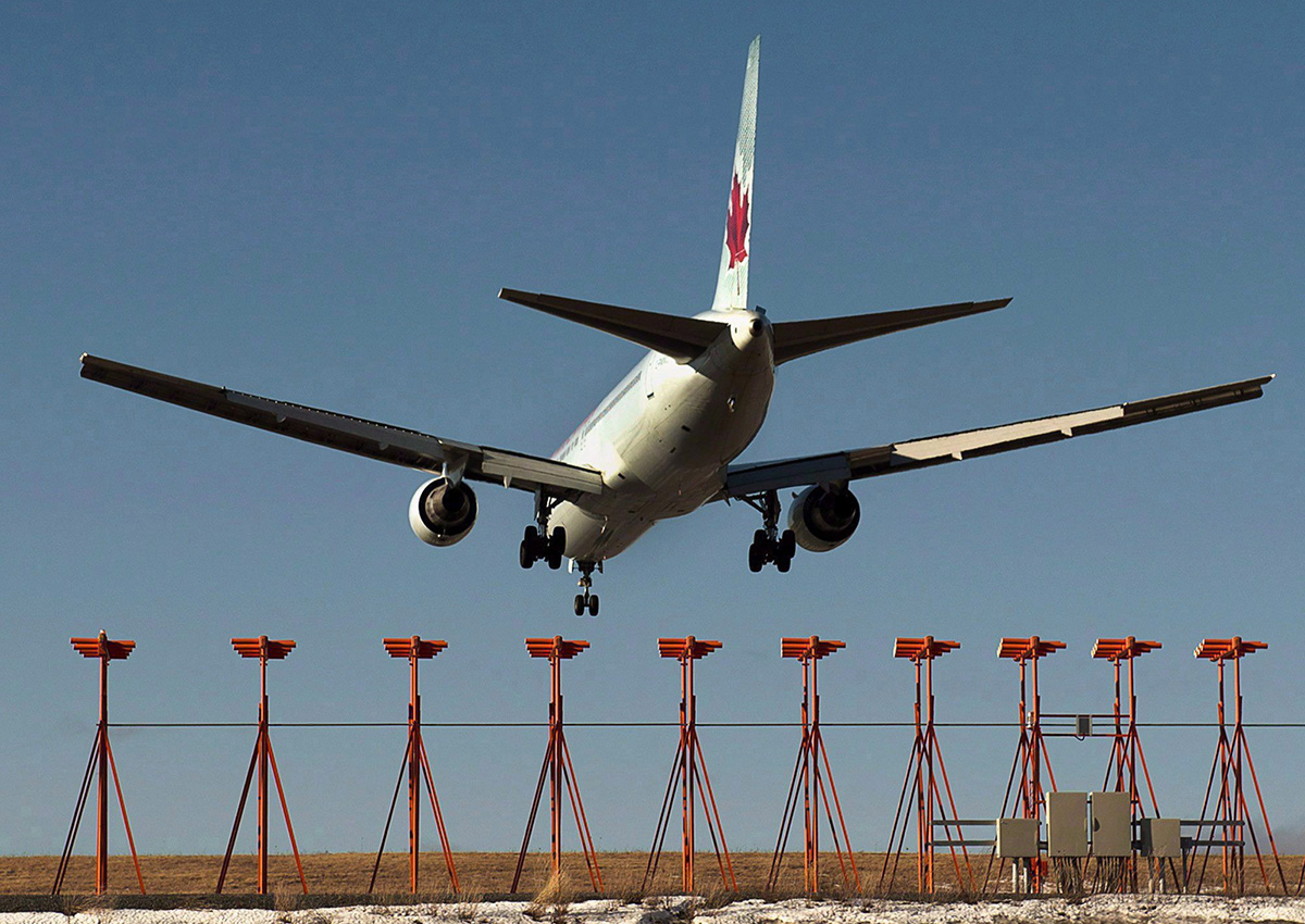 An Air Canada passenger jet lands at Halifax Stanfield International Airport in Halifax on Monday, Jan. 21, 2013. 