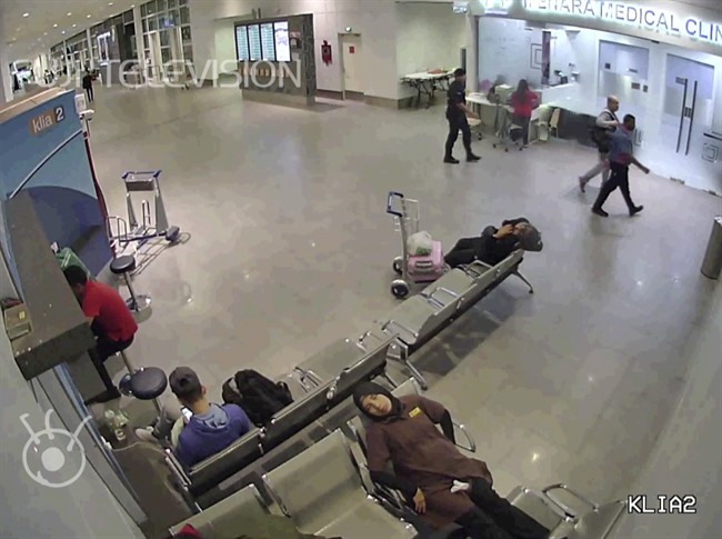 In this image made from Feb. 13, 2017, airport closed circuit television video and provided by Fuji Television, Kim Jong Nam, second from right, exiled half-brother of North Korea\’s leader Kim Jong Un, walks with an airport security official towards a medical clinic, top right, after he was attacked at Kuala Lumpur International Airport, Malaysia.