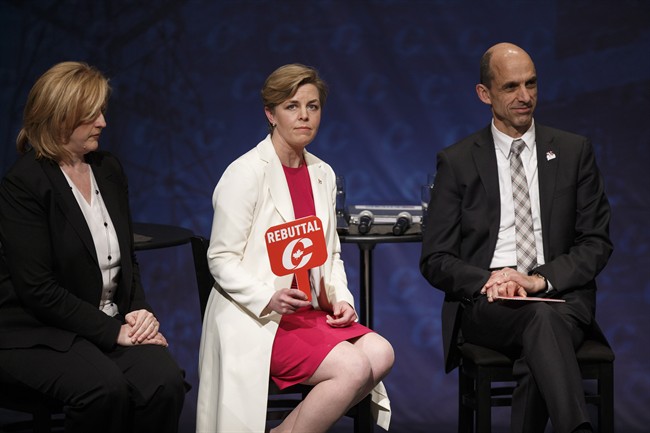 Kellie Leitch holds up a rebuttal sign during the Conservative leadership debate at the Maclab Theatre in Edmonton, Alta., on Tuesday, Feb. 28, 2017.