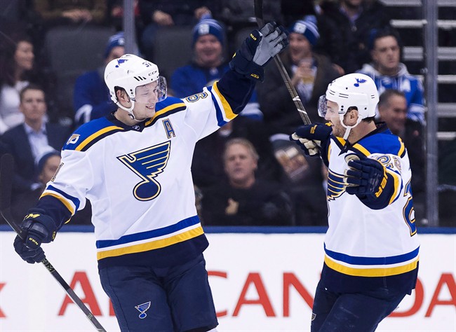 St. Louis Blues right wing Vladimir Tarasenko (91) celebrates his game-winning goal with defenceman Kevin Shattenkirk (22) after scoring against the Toronto Maple Leafs during the overtime period of an NHL game in Toronto on Thursday, February 9, 2017.