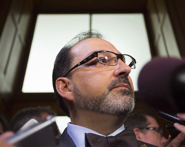 Ontario Energy Minister, Glenn Thibeault arrives to speak with the media in Toronto on Monday Sept. 12, 2016.