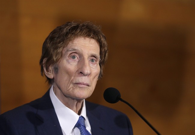 Detroit Tigers owner Mike Ilitch listens during a news conference in Detroit in this Nov. 14, 2014 file photo.