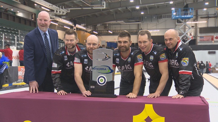 Mike McEwen, BJ Neufeld, Matt Wozniak and Denni Neufeld pose with the Viterra Championship trophy after repeating as champs.