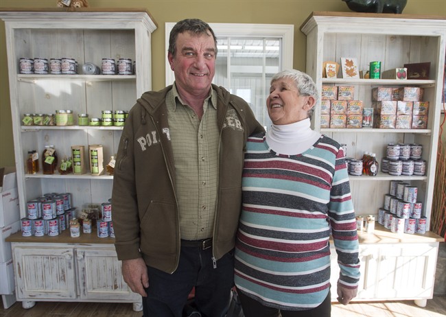 Nicole Varin and her husband Harold Varin, pose for a photo in the boutique at there sugar shack Friday, February 10, 2017 in Oka, Quebec. Quebec, the world's largest producer of maple syrup, is ramping up output as it fends off rising competition from the U.S. and neighbouring provinces as well as a farmer rebellion from within.