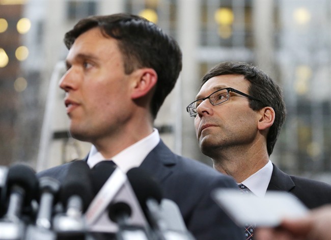 Washington state Solicitor General Noah Purcell, left, and Attorney General Bob Ferguson, right, listen to questions from reporters, following a hearing in federal court Friday, Feb. 3, 2017, in Seattle. A U.S. judge on Friday temporarily blocked President Donald Trump's ban on people from seven predominantly Muslim countries from entering the United States after Washington state and Minnesota urged a nationwide hold on the executive order that has launched legal battles across the country.