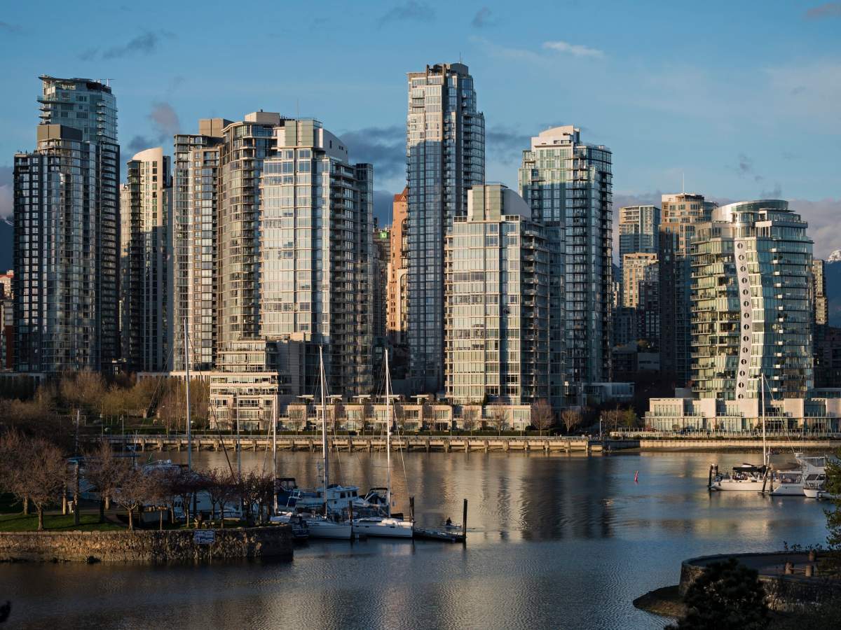 A scenic view from the South side of Vancouver’s False Creek waterway taking in the shoreline seawall, East end of Granville Island and the North shoreline\’s high-rise condominium towers, Vancouver, B.C., March 27, 2016.