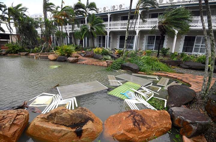 Outdoor furniture lies in a pool at a motel as Cyclone Debbie hits the northern Queensland town of Airlie Beach, located south of Townsville in Australia. AAP/Dan Peled/via REUTERS