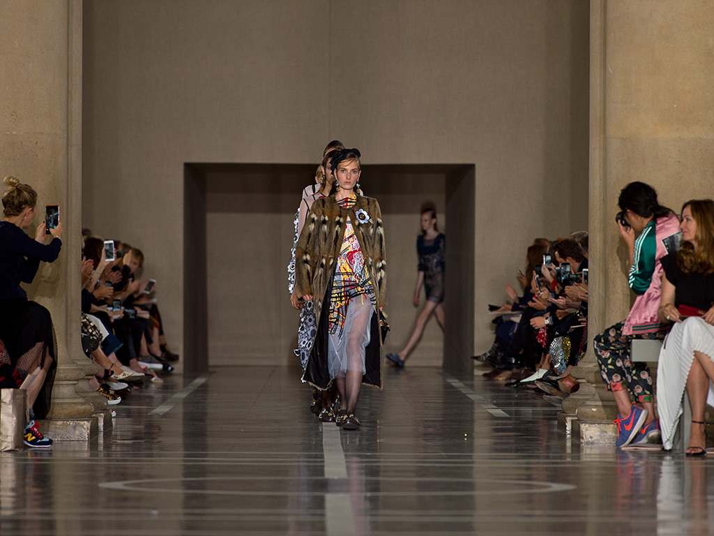 Models come down the runway for the finale of the Christopher Kane spring 2017 presentation in London on Sept. 19, 2016.