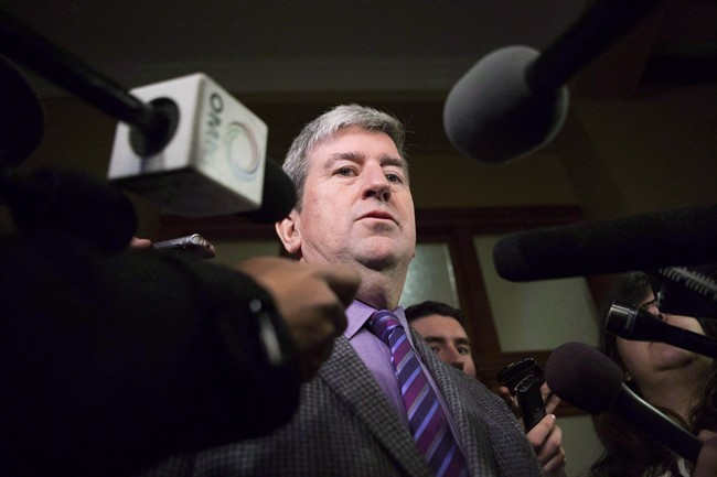 Glen Murray talks to media at Queens Park in Toronto on Thursday, December 12, 2013.