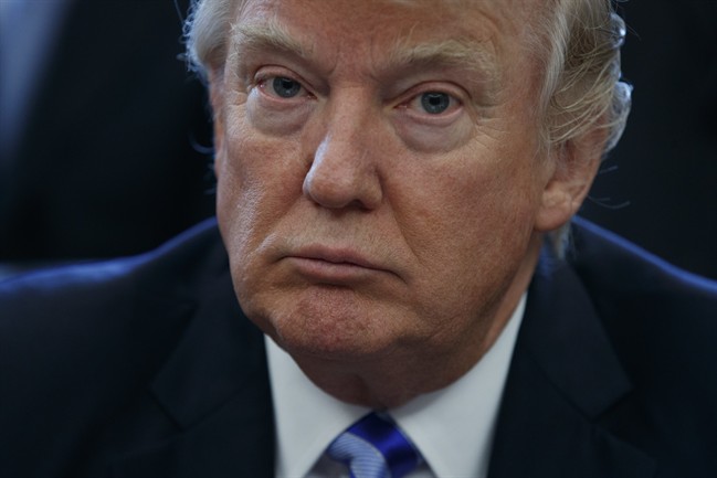 President Donald Trump pauses in the Oval Office of the White House in Washington Friday, March 24, 2017.