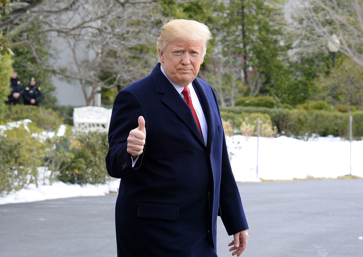 Donald Trump walks on the South Lawn of the White House toward Marine One as he departs the White House.