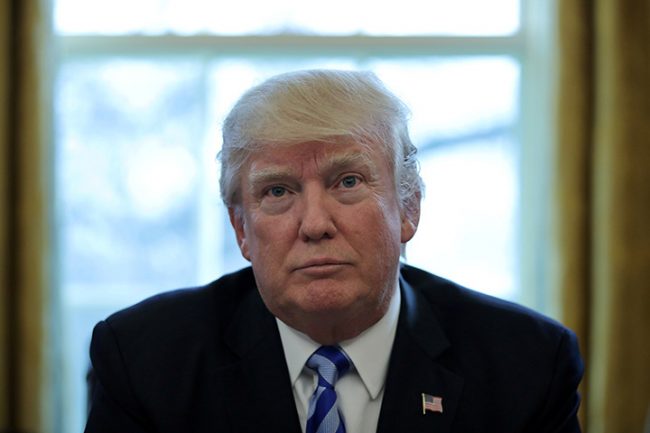 U.S. President Donald Trump talks to journalists at the Oval Office of the White House in Washington, March 24, 2017. 