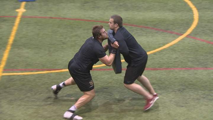 Geoff Gray takes part in a blocking drill during his pro day workout. 