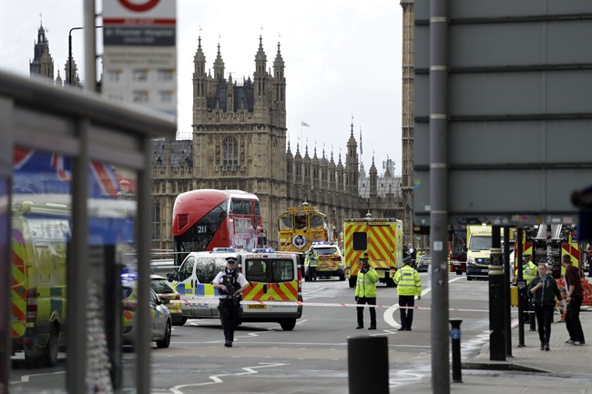 Police secure the area close to the Houses of Parliament in London, Wednesday, March 22, 2017. 