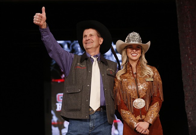 World Champion chuckwagon driver Kelly Sutherland reacts after he was auctioned off during the annual Calgary Stampede Canvas Auction where businesses bid on sponsoring a chuckwagon driver for the upcoming Calgary Stampede in Calgary, Thursday, March 23, 2017.