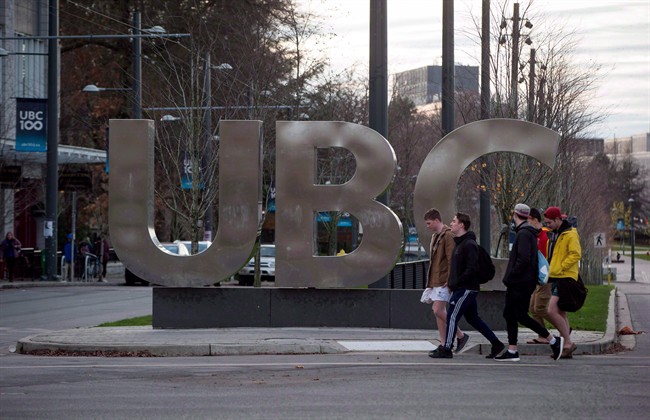 The University of British Columbia is set to vote on a new sexual misconduct policy in the wake of allegations it mishandled complaints against a history PhD student and former creative writing chairman Steven Galloway. People walk past large letters spelling out UBC at the University of British Columbia in Vancouver, B.C., on November 22, 2015. 