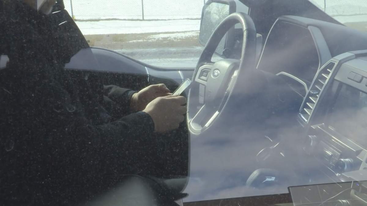 A person can be seen using their cell phone during a ride along with the Regina Police Service Bus Cop program.