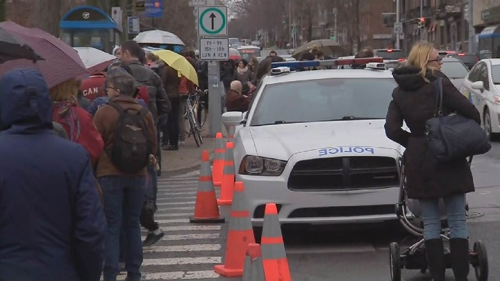 Montreal police block street, as French voters stand in line waiting to cast a ballot in their country’s presidential election. Saturday, April 22, 2017.