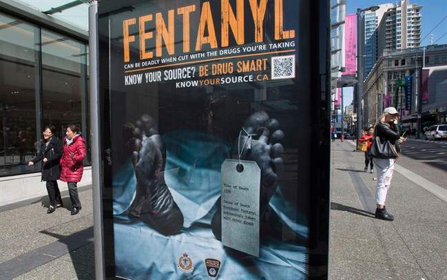 An anti-fentanyl advertisment is seen on a sidewalk in downtown Vancouver, Tuesday, April, 11, 2017.