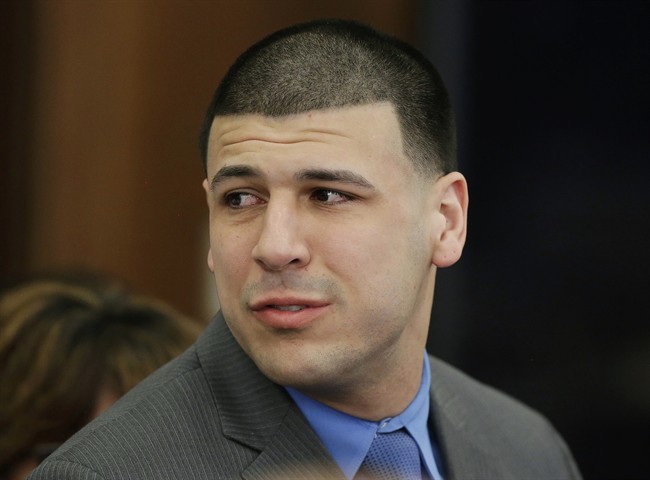 In this Friday, April 14, 2017, file photo, Former New England Patriots tight end Aaron Hernandez turns to look toward his fiancee Shayanna Jenkins Hernandez as he reacts to his double murder acquittal at Suffolk Superior Court in Boston.