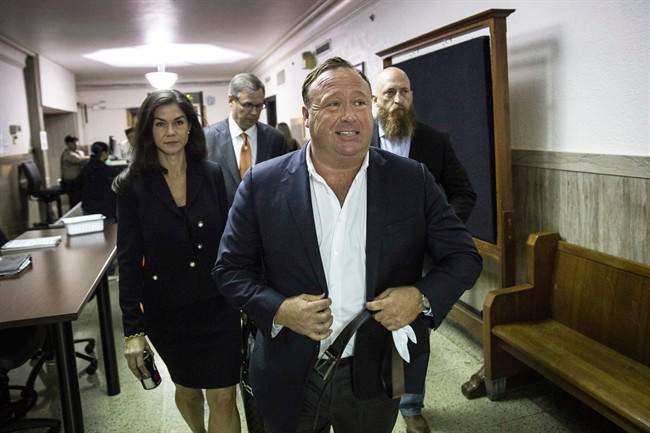 In this Monday, April 17, 2017 photo, “Infowars” host Alex Jones arrives at the Travis County Courthouse in Austin, Texas.